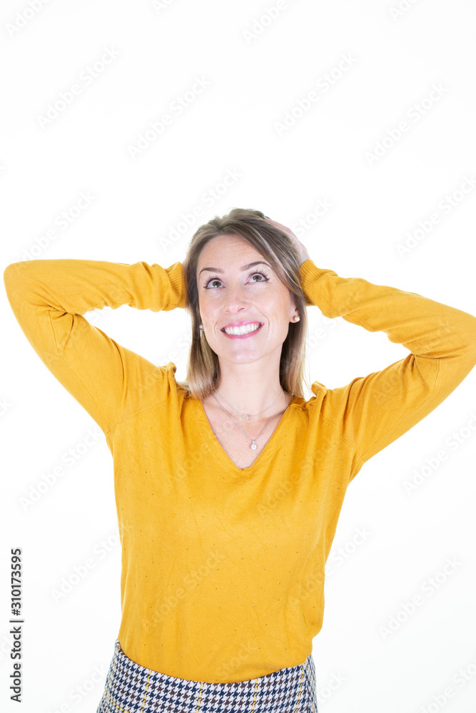 pretty woman beauty over white wall thinking an idea while looking up pretty woman beauty over white wall thinking an idea while looking up