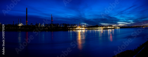 River rhine with oil refinery in the background, longtime shot