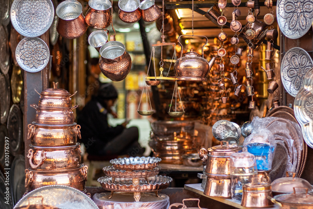 Bench with copper utensils in the eastern bazaar. Bench with copper utensils in the eastern bazaar.