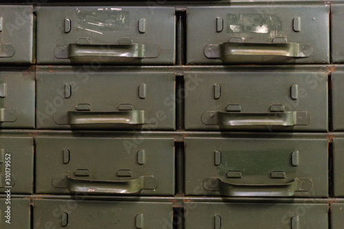 Green industrial metal drawers waiting for contents