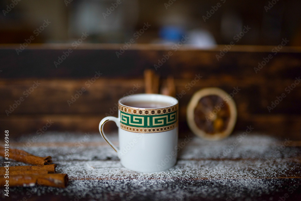 dried oranges cinnamon sticks on a wooden table dried oranges cinnamon sticks on a wooden table