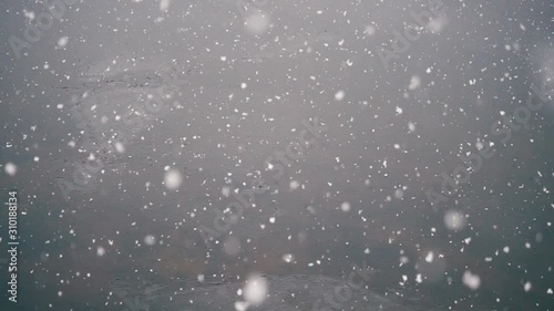 Winter, snow falling, snowflake in slow motion