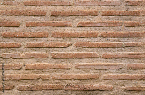 Full frame image of byzantine red brick wall with special thin flat bricks called plinfa. High resolution texture of old antique brickwork for 3d models, background, pattern etc.. Close-up view