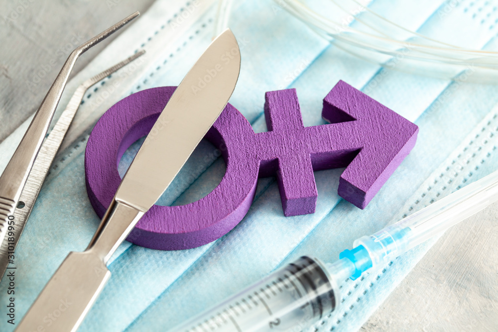 Sexchange operation. Transgender symbol and scalpel with a syringe. Surgical Instruments Stock