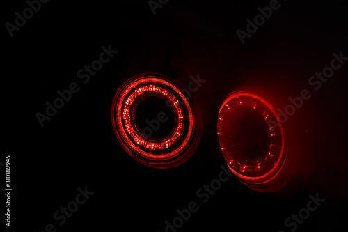 Alight rear lights Nissan GT-R in the dark garage with smoke