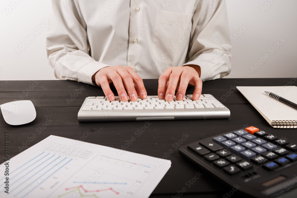 Close up of man accountant or banker making calculations. Close up of man accountant or banker making calculations.