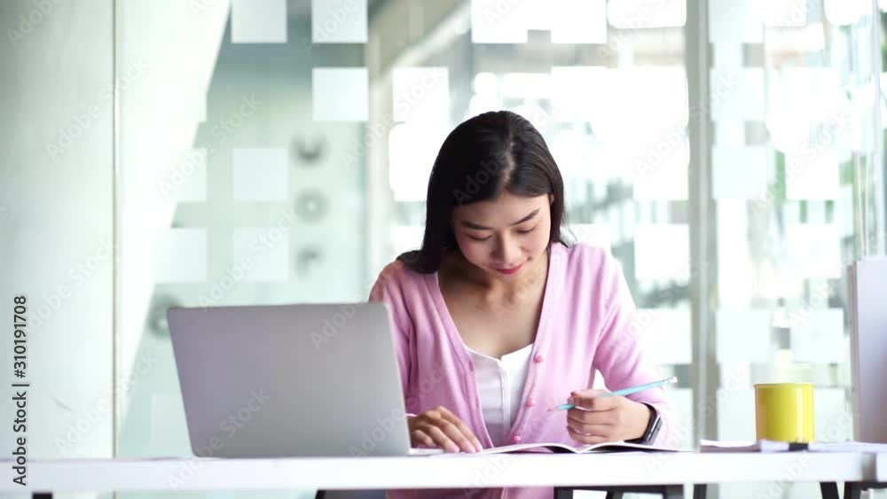 Portrait of comfident young  entrepreneur businesswoman working in modern work station.