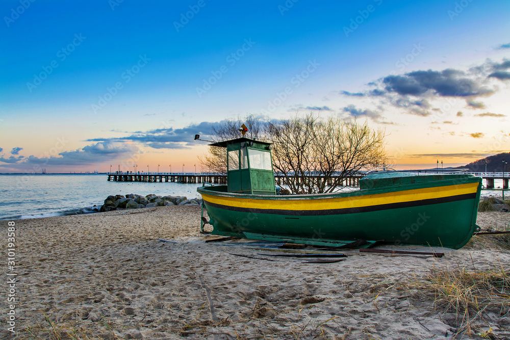fishing boat on the beach in Gdansk, Poland fishing boat on the beach in Gdansk, Poland