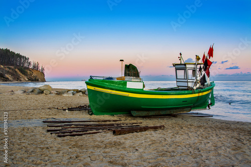 Fototapeta Naklejka Na Ścianę i Meble -  fishing boat on the beach in Gdansk, Poland