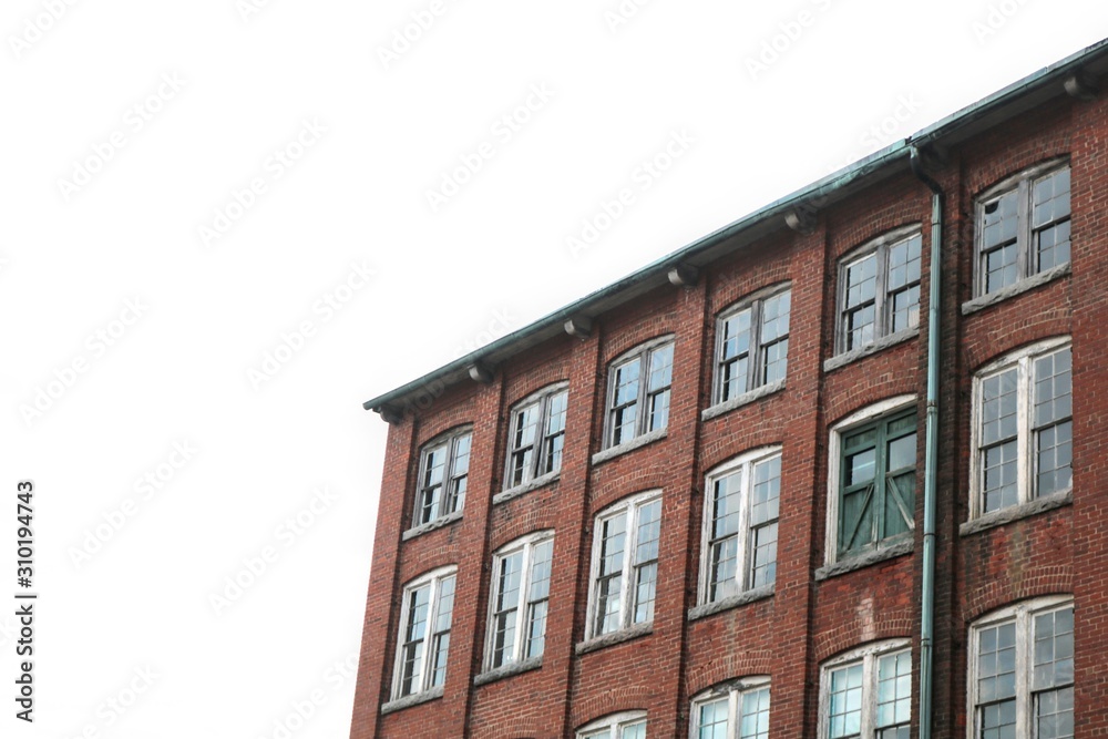 Fototapeta premium Old abandoned brick factory clock tower industrial vacant building with clock 