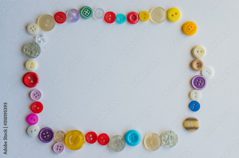 frame of colored buttons on a white background frame of colored buttons on a white background