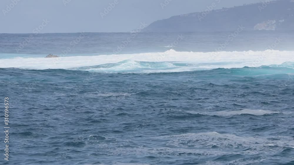 Waves rolling on blue turquoise sea - breaking waves Waves rolling on blue turquoise sea - breaking waves