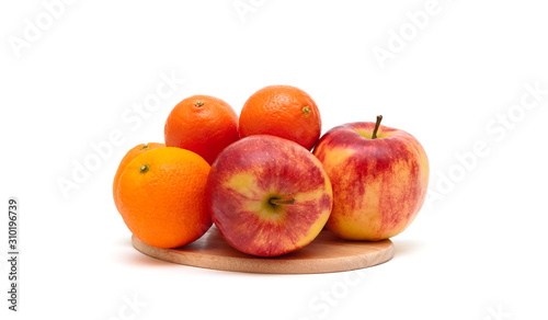 tangerines, apples and oranges on a white background