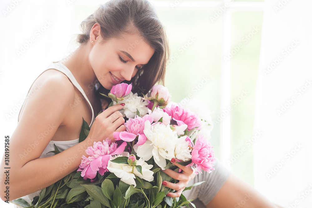 Close up portrait of young beautiful woman with flowers indoors Close up portrait of young beautiful woman with flowers indoors