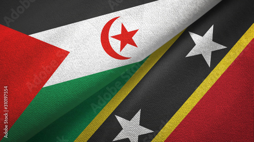 Western Sahara and Saint Kitts and Nevis two flags textile cloth, fabric texture photo