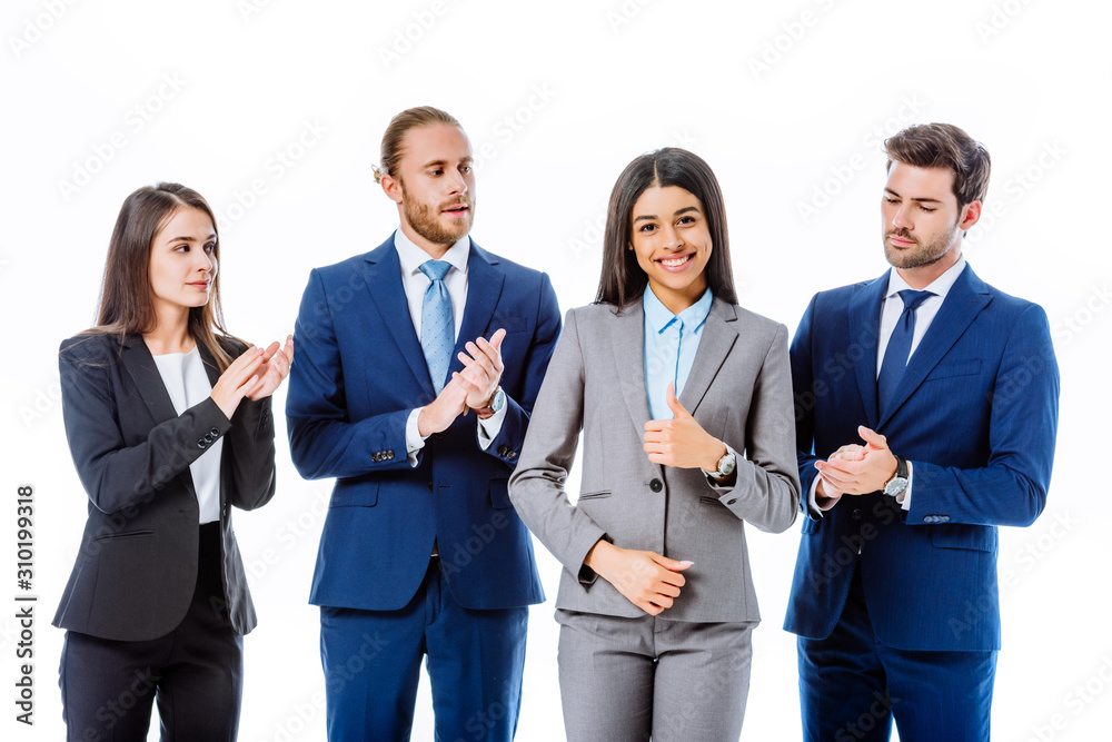 business people in suits applauding smiling african american businesswoman isolated on white business people in suits applauding smiling african american businesswoman isolated on white