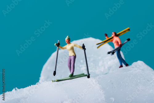 miniature skiers