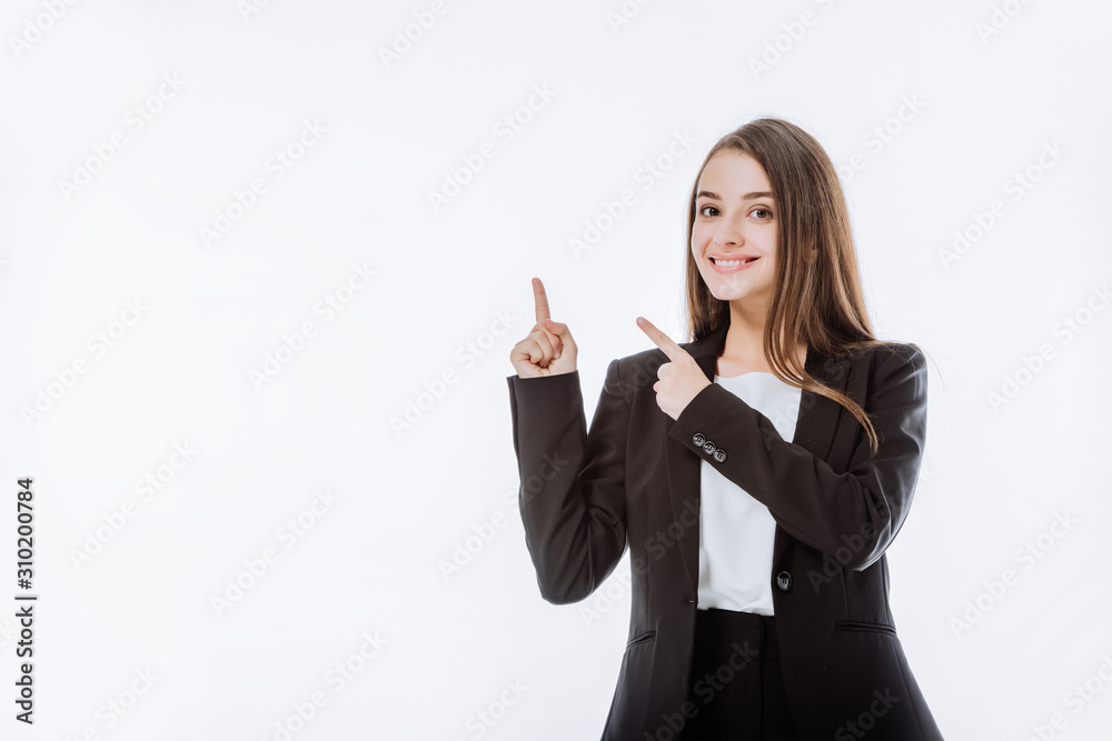 smiling businesswoman in suit pointing with fingers up isolated on white smiling businesswoman in suit pointing with fingers up isolated on white