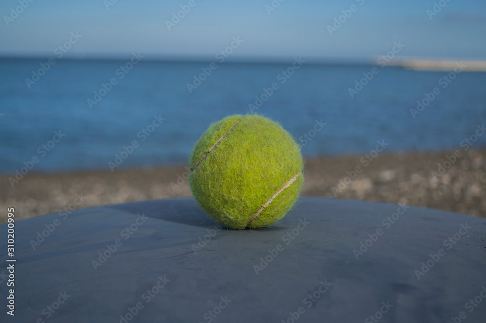 tennis ball on the beach