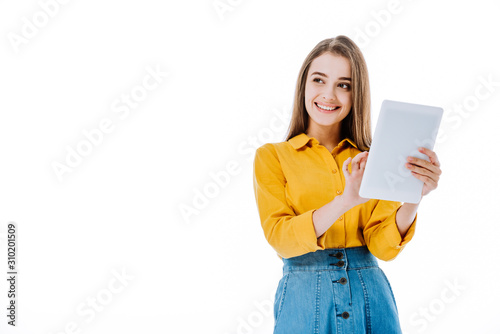 smiling attractive girl using digital tablet isolated on white