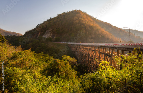 Phor Khun Pha Muang Bridge(Huai Tong Bridge) in the morning The bridge with the highest wooden pier in Thailand, behind is the mountain view. In Phetchabun province.