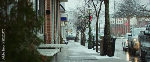 Snowy street with Festival decoration and Snow falling in Slow Motion