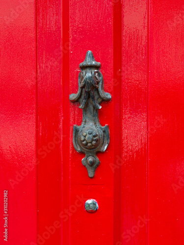 Close-up of peephole against red door, Sligo, County Sligo, Ireland © klevit