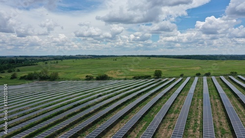 Solar Panel Farm in Countryside (Drone)
