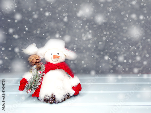 winter background with snowman decor and snow