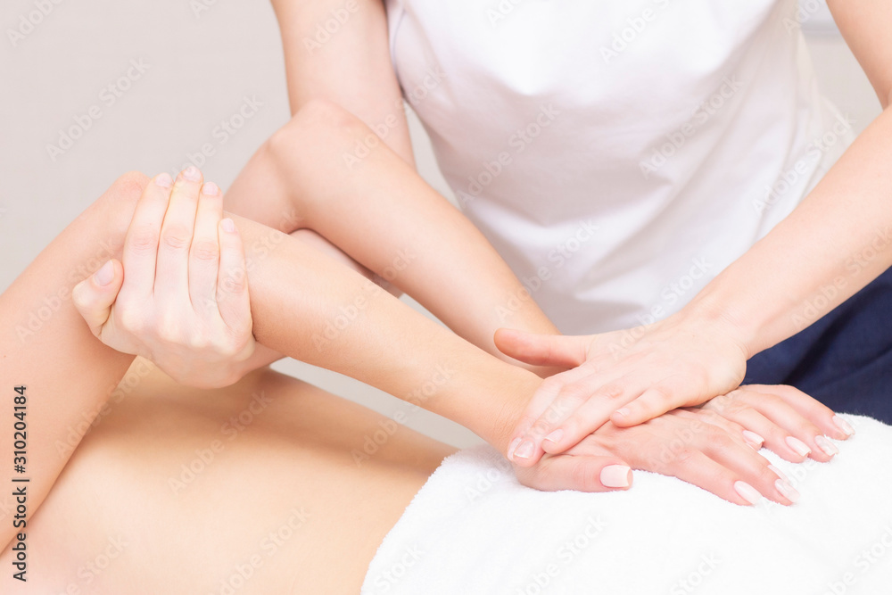 Massage and body care. Spa woman body massage with hands treatment. Stretching the back muscles. Woman having massage at the spa for beautiful girl Massage and body care. Spa woman body massage with hands treatment. Stretching the back muscles. Woman having massage at the spa for beautiful girl