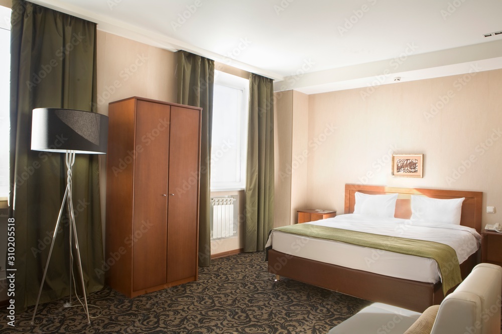 Fototapeta premium Empty Hotel Bedroom