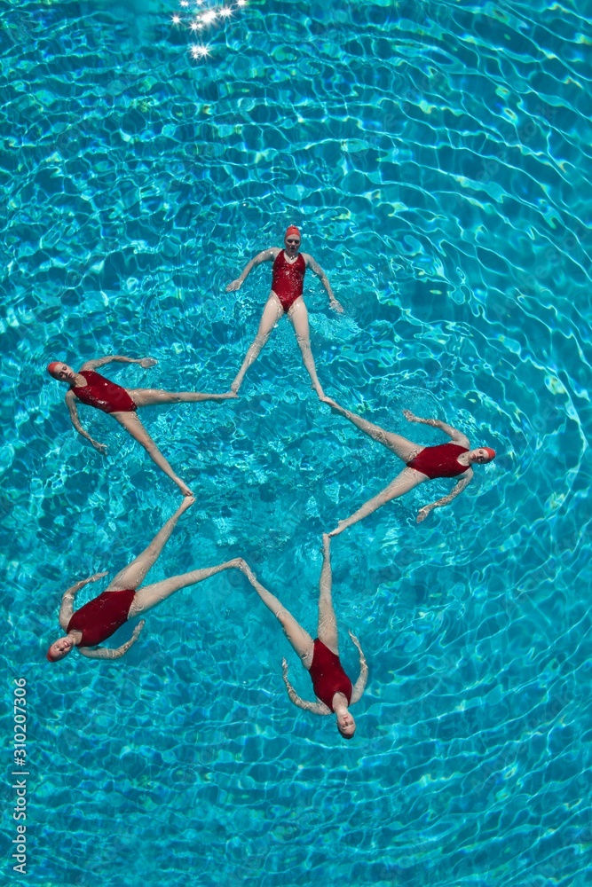 Synchronised Swimmers Forming A Star Shape