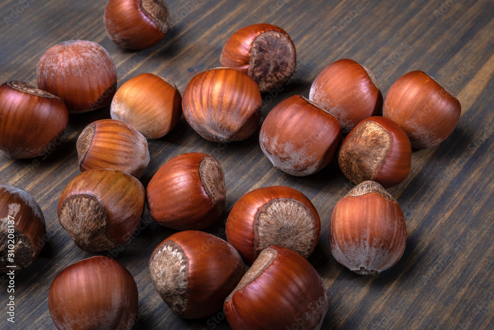 Hazelnuts on a wooden table. Food, snack background Hazelnuts on a wooden table. Food, snack background
