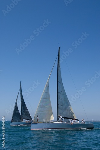 Sailboats Racing In The Blue Ocean Against Sky © moodboard