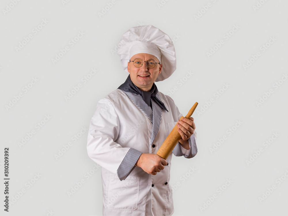 chef in uniform on a gray background. chef in uniform on a gray background.