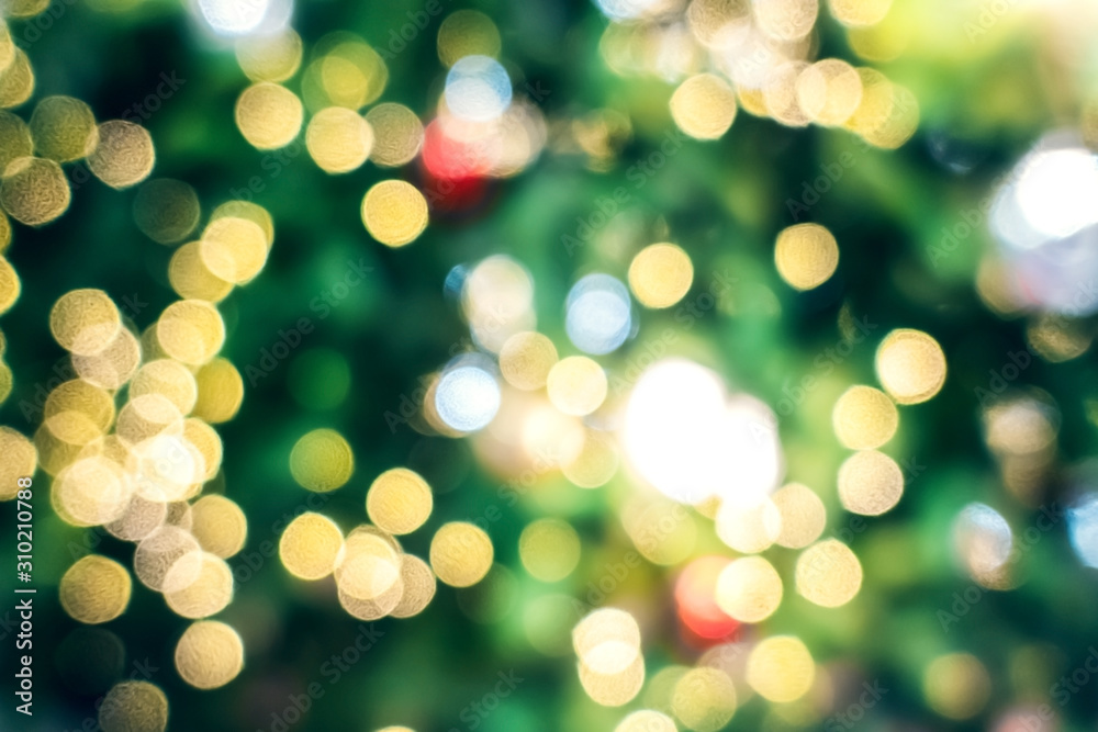 Blurry background of beautiful Christmas light bokeh on Christmas tree