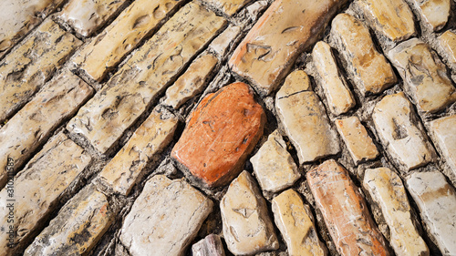 Stone pavement texture. Old cobble stoned pavement background. Details. Jerusalem, Israel. 16:9 panoramic format