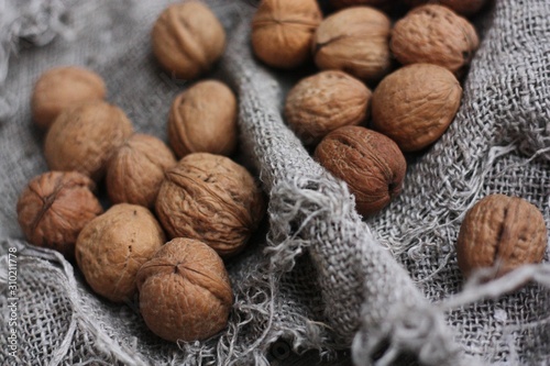 Walnuts on a grey linen background macro 