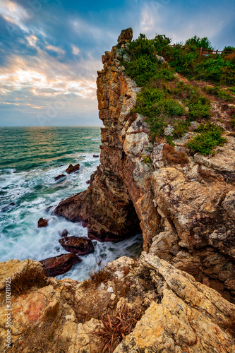 sunset at the cliffs by ocean in Luzui mountain, Shenzhen, China