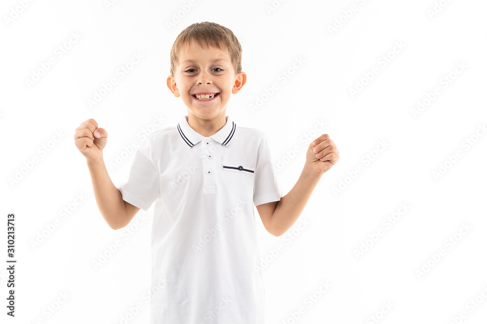 smiling attractive boy with brown hair and bangs on a white background with copy space smiling attractive boy with brown hair and bangs on a white background with copy space