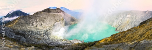 (High Resolution Image) Stunning panoramic view of the Ijen volcano with the beautiful turquoise-coloured acidic crater lake. The Ijen volcano is located in Banyuwangi Regency, East Java, Indonesia.