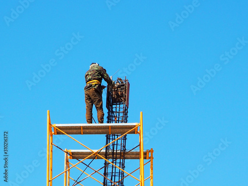 Man working on the Working at height in construction site