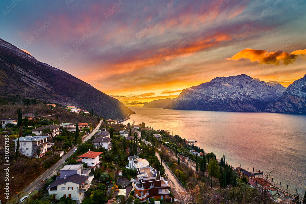 Beautiful Panorama in the Torbole a small town on Lake Garda in the winter time  at sunset, Lake Garda surrounded by mountains, Trentino Alto Adige region, Lago di garda, italy