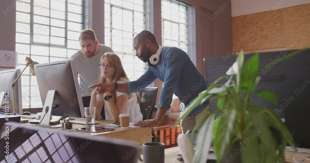 Young creative African American man professionals working in a modern office Young creative African American man professionals working in a modern office