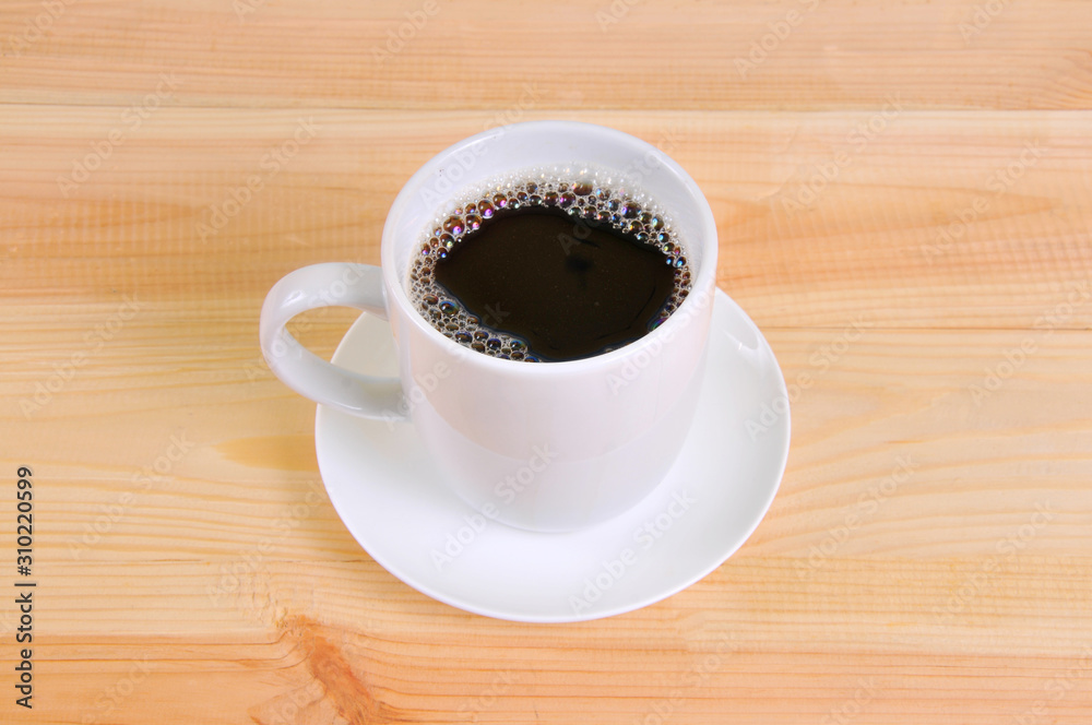 Coffee cup on wooden table background Coffee cup on wooden table background