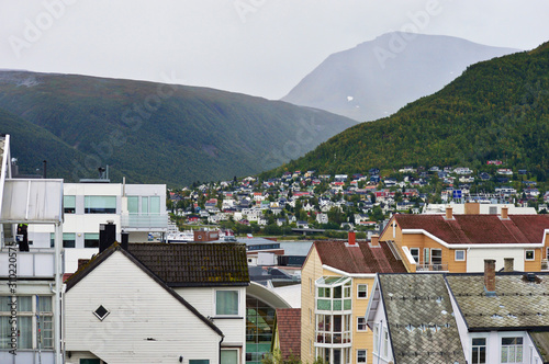 Houses in the city of Tromso with mountains background © Jakub