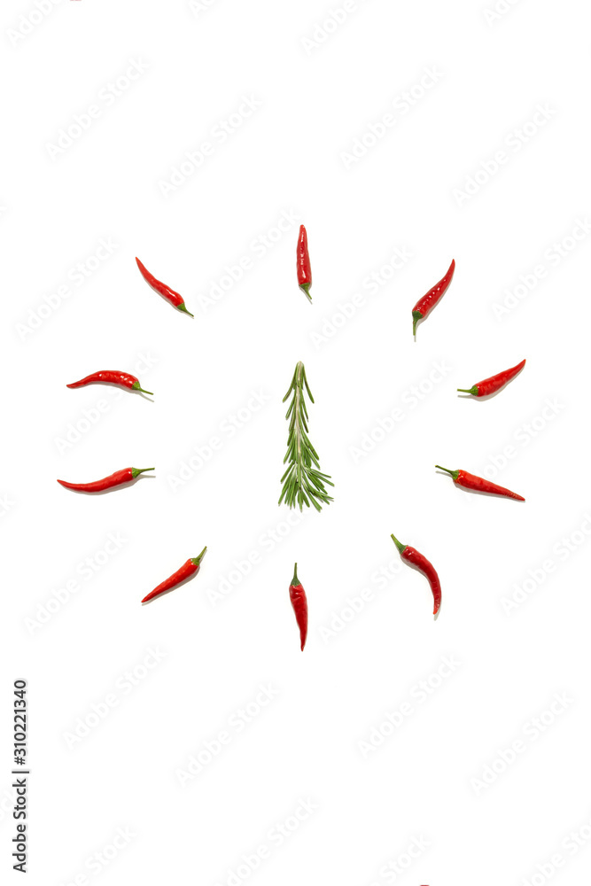 Abstract Christmas background in the form of a clock and a fir tree made of rosemary and chili pepper on a white background. Food concept, Christmas minimalism Abstract Christmas background in the form of a clock and a fir tree made of rosemary and chili pepper on a white background. Food concept, Christmas minimalism