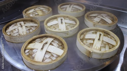 Dimsum or Dumplings steam in the kitchen of Chinese restaurant close up. 
