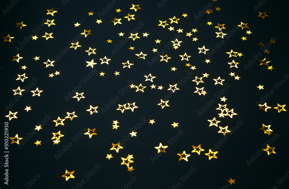 golden stars on a black background