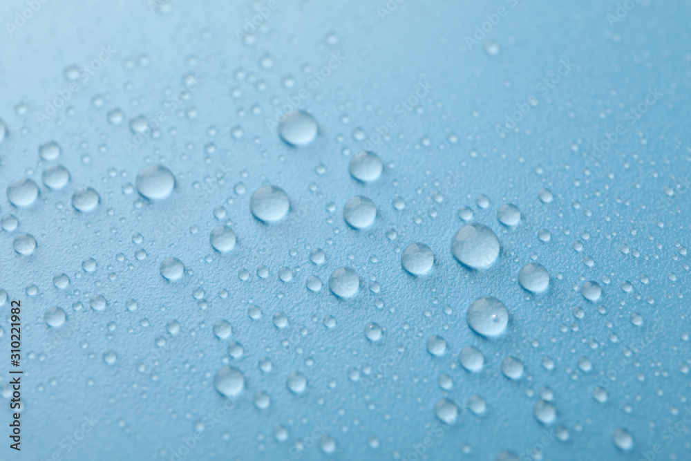 Many water drops on blue background. Texture background.